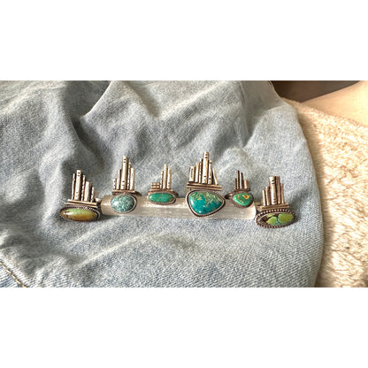 Silver rings with turquoise stones on a denim background