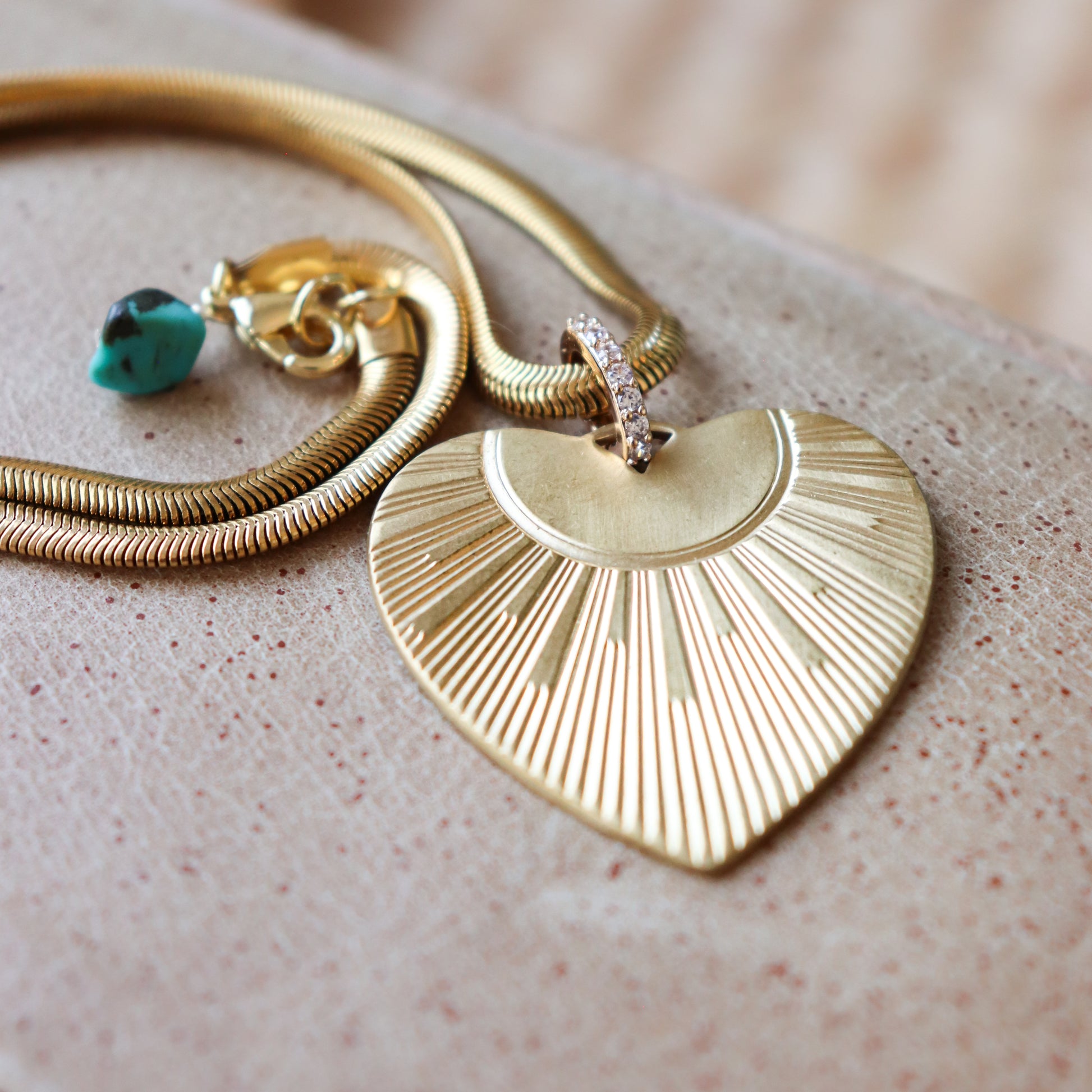 details of brass heart necklace with chain and clasp