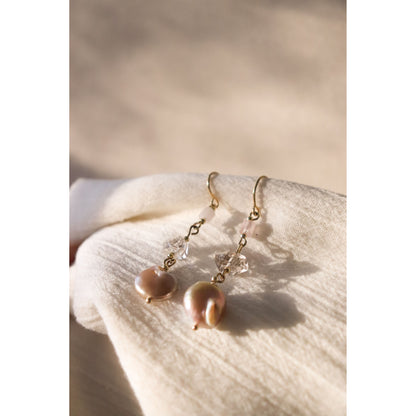 gemstone Earrings laying with sun shining on them