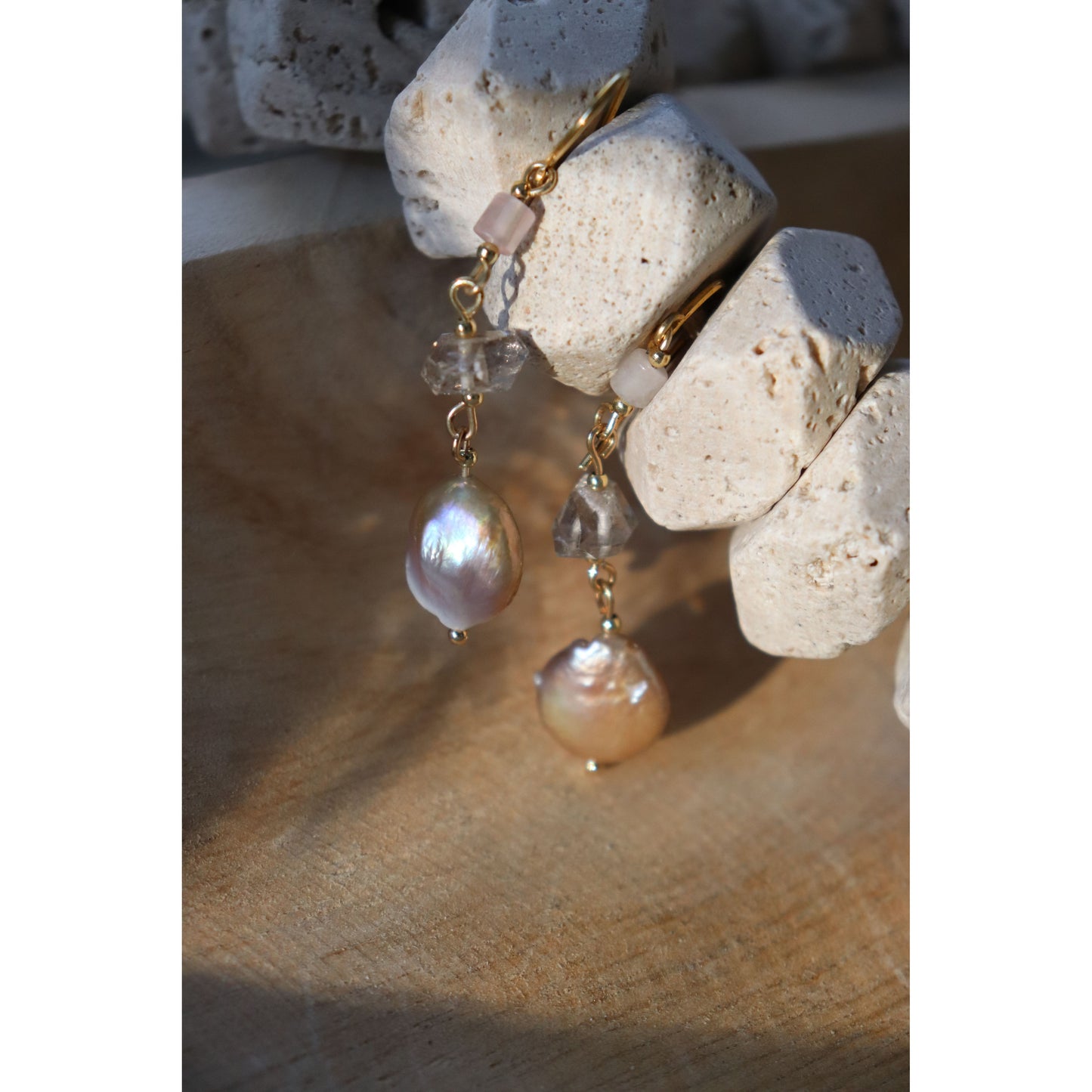detail shot of earrings hanging on rocks