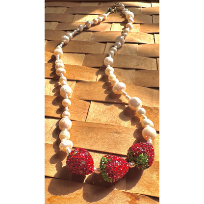 close up of pearl and strawberry necklace