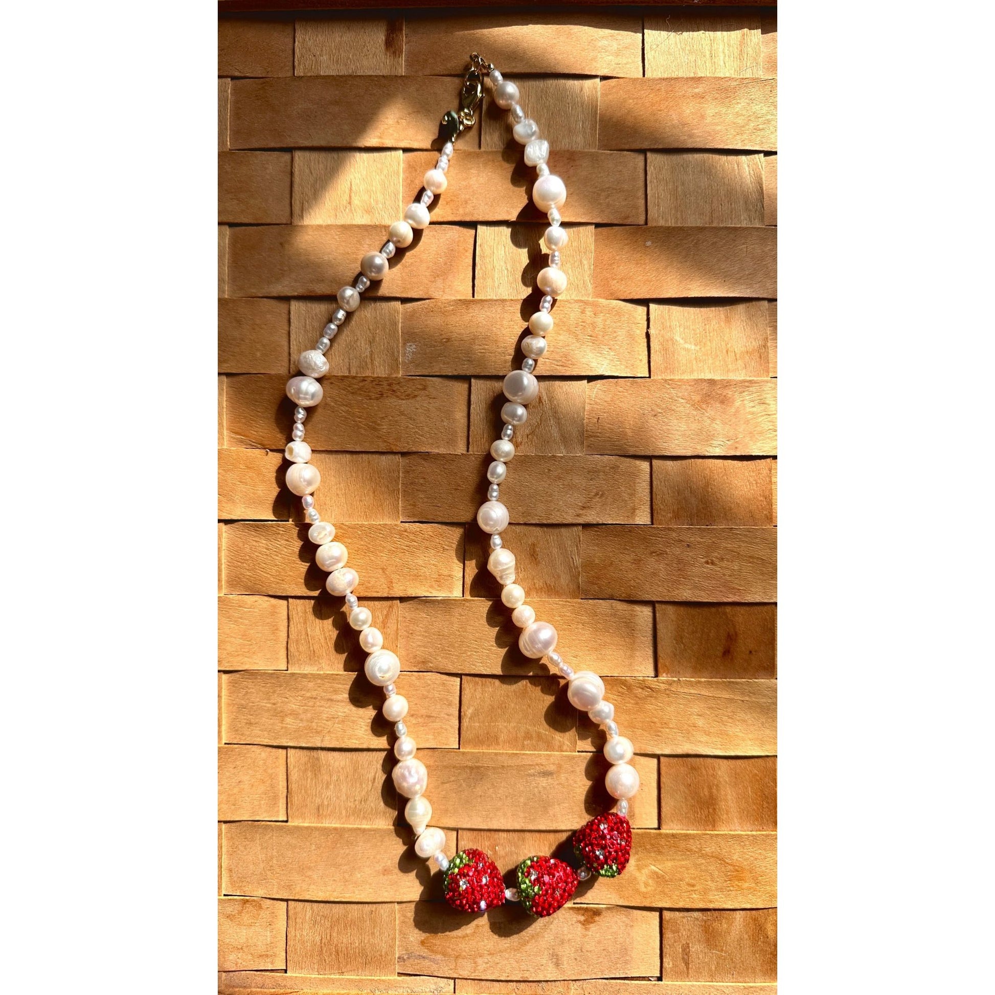 Pearl necklace laying on basket