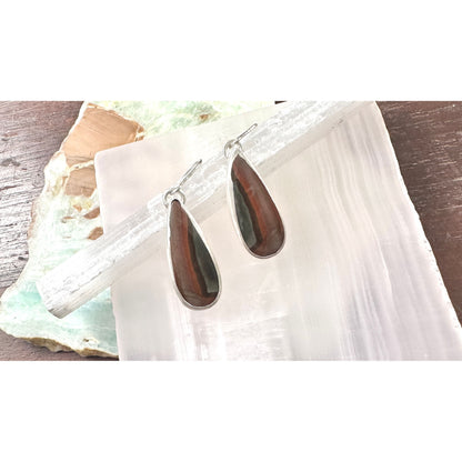 Teardrop gemstone earrings on stones