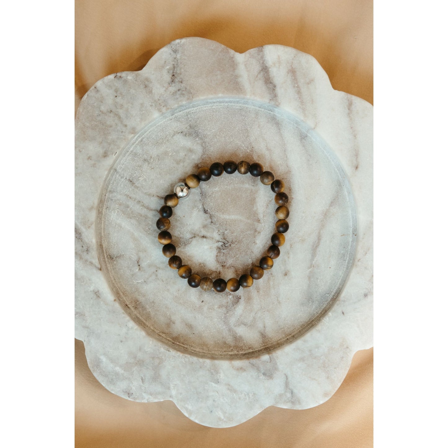 Tigers eye Bracelet on marble surface