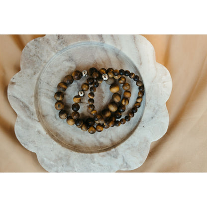 3 bracelets on marble surface