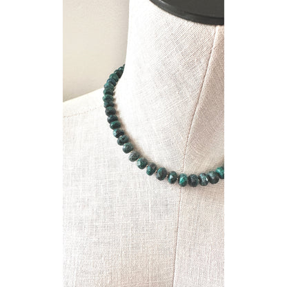 Necklace with blue beads on a mannequin